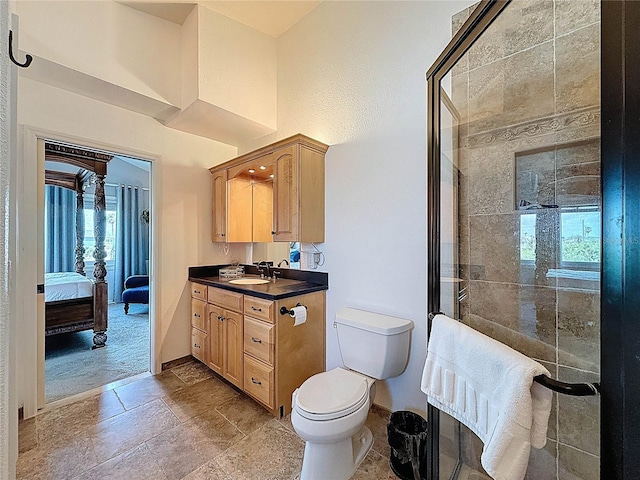 4116 Diaz Ct, Hernando Beach, FL 34607 - bathroom with plenty of natural light, baseboards, vanity, and stone tile floors