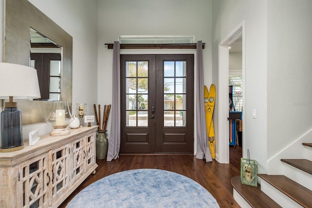 182 E Canal Dr, Palm Harbor, FL 34684 - entryway featuring french doors, stairway, and wood finished floors