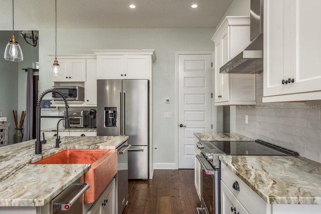 182 E Canal Dr, Palm Harbor, FL 34684 - kitchen featuring white cabinets, wall chimney exhaust hood, appliances with stainless steel finishes, dark wood finished floors, and light stone counters