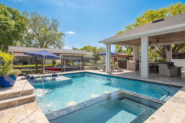 182 E Canal Dr, Palm Harbor, FL 34684 - view of swimming pool featuring outdoor dry bar, area for grilling, a patio area, a pool with connected hot tub, and a gazebo