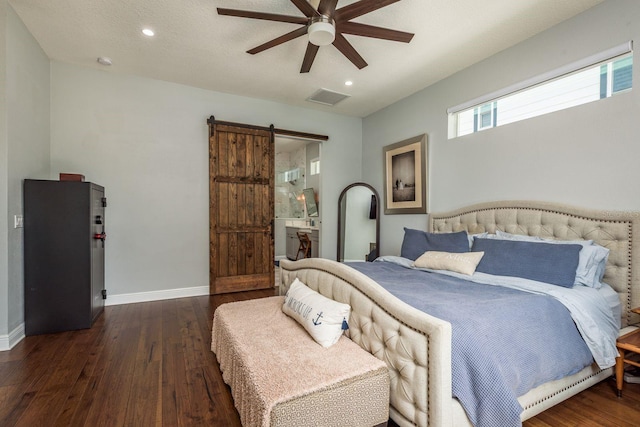 182 E Canal Dr, Palm Harbor, FL 34684 - bedroom with baseboards, recessed lighting, a barn door, visible vents, and hardwood / wood-style floors