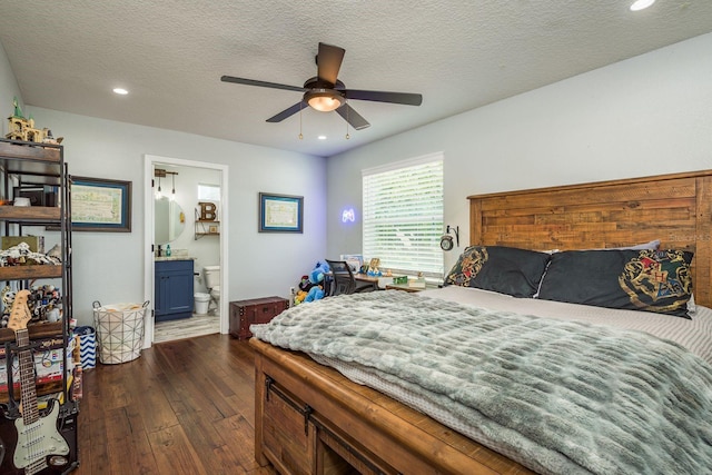 182 E Canal Dr, Palm Harbor, FL 34684 - bedroom featuring dark wood-style flooring, recessed lighting, ensuite bath, a textured ceiling, and a ceiling fan