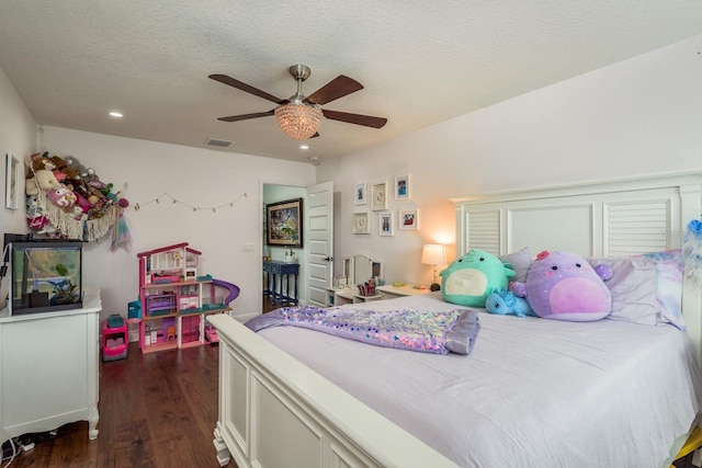 182 E Canal Dr, Palm Harbor, FL 34684 - bedroom featuring recessed lighting, dark wood finished floors, a textured ceiling, visible vents, and ceiling fan