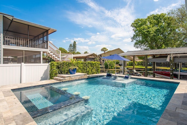 182 E Canal Dr, Palm Harbor, FL 34684 - view of pool with a pool with connected hot tub, a sunroom, and stairs