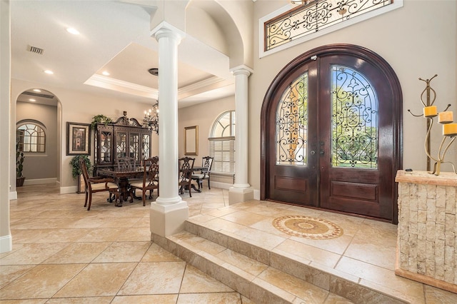 3607 Berger Rd, Lutz, FL 33548 - foyer featuring arched walkways, french doors, ornate columns, recessed lighting, and a chandelier