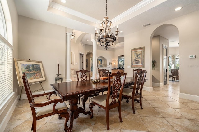 3607 Berger Rd, Lutz, FL 33548 - dining area with ornamental molding, arched walkways, a chandelier, a tray ceiling, and recessed lighting