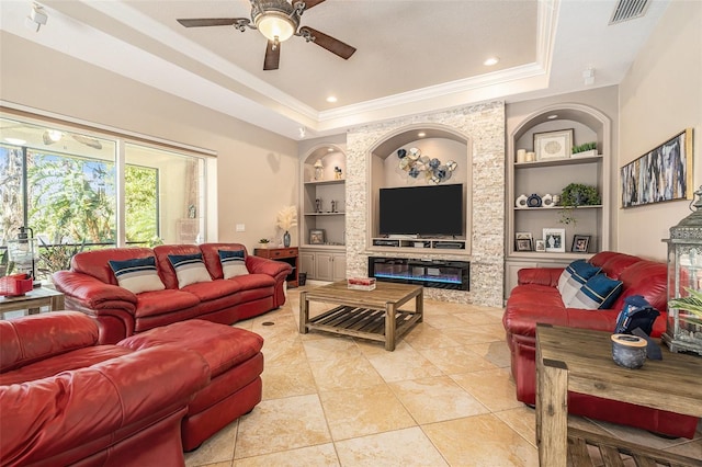3607 Berger Rd, Lutz, FL 33548 - living area featuring built in features, a tray ceiling, ornamental molding, a ceiling fan, and light tile patterned floors