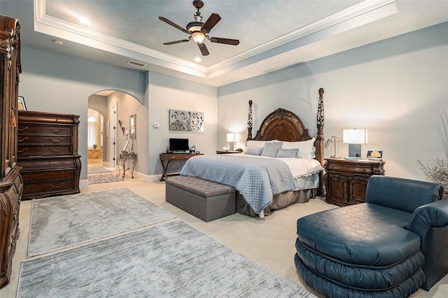 3607 Berger Rd, Lutz, FL 33548 - bedroom with a tray ceiling, arched walkways, carpet floors, ornamental molding, and a ceiling fan