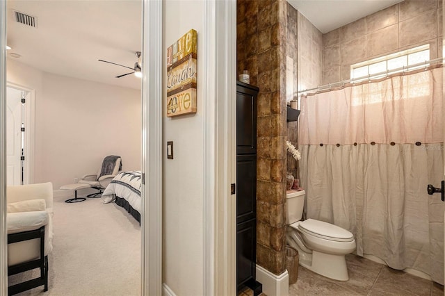 3607 Berger Rd, Lutz, FL 33548 - ensuite bathroom with ceiling fan and a shower with shower curtain