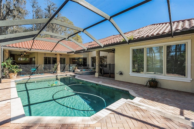 3607 Berger Rd, Lutz, FL 33548 - swimming pool with a patio, a ceiling fan, and glass enclosure