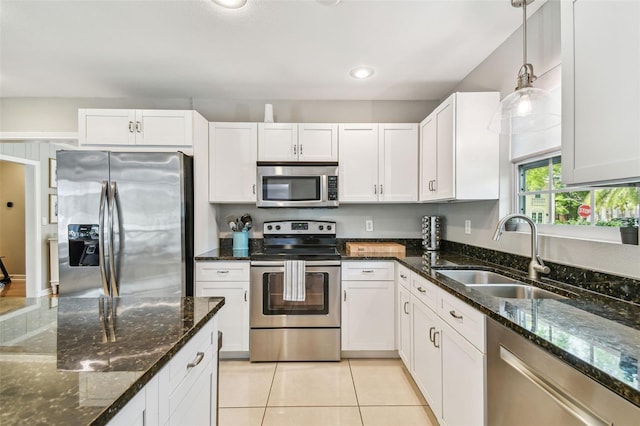 kitchen featuring white cabinets, a sink, and appliances with stainless steel finishes