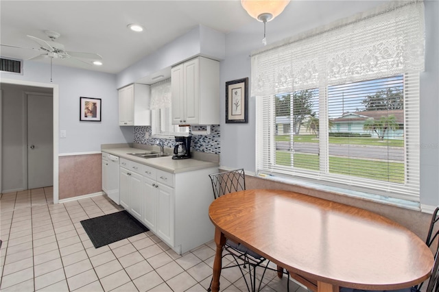 733 Ojai Ave, Sun City Center, FL 33573 - kitchen featuring ceiling fan, light tile patterned flooring, white cabinetry, light countertops, and recessed lighting