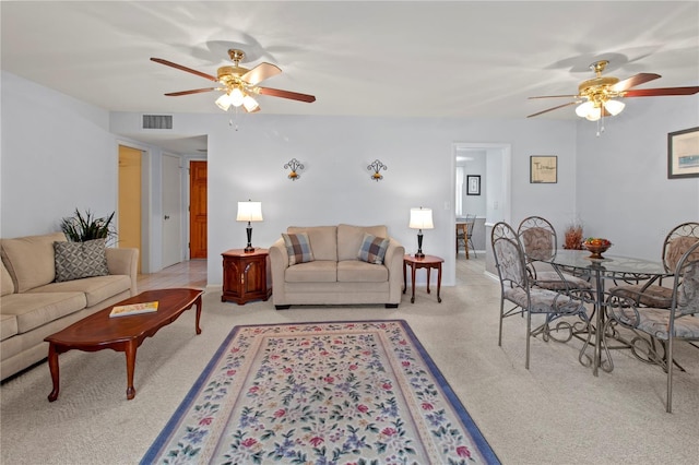 733 Ojai Ave, Sun City Center, FL 33573 - living room with ceiling fan and light carpet