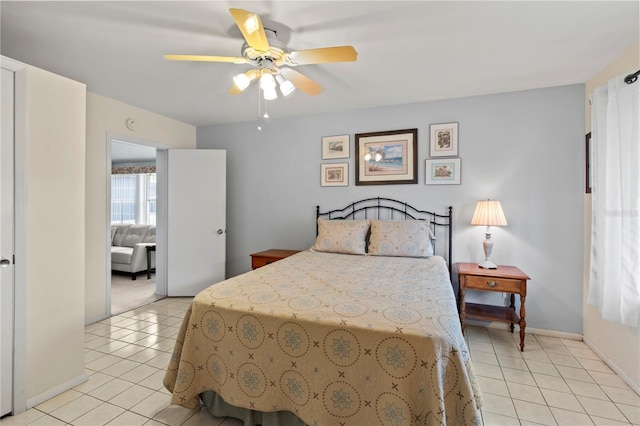 733 Ojai Ave, Sun City Center, FL 33573 - bedroom featuring light tile patterned floors and a ceiling fan
