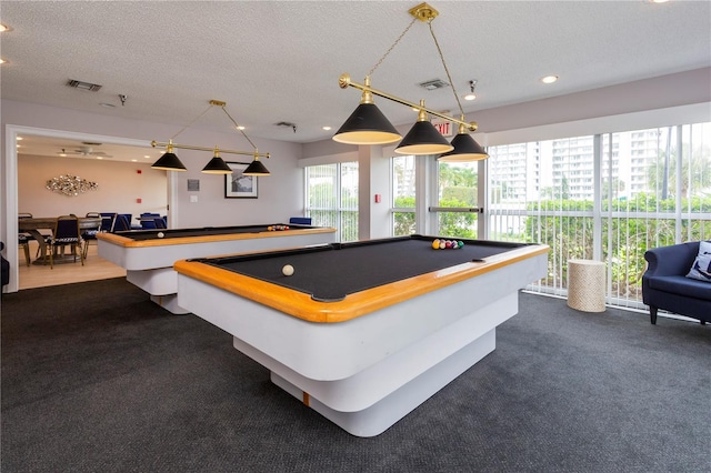 game room with a textured ceiling, visible vents, and billiards