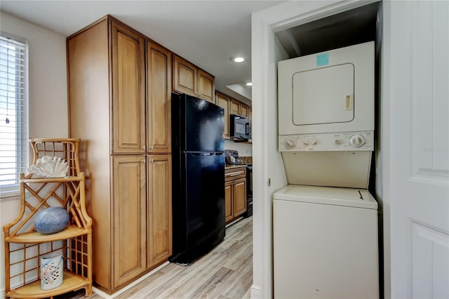 19925 Gulf Blvd Unit 502, Indian Shores, FL 33785 - washroom featuring laundry area, stacked washer and clothes dryer, light wood finished floors, and recessed lighting