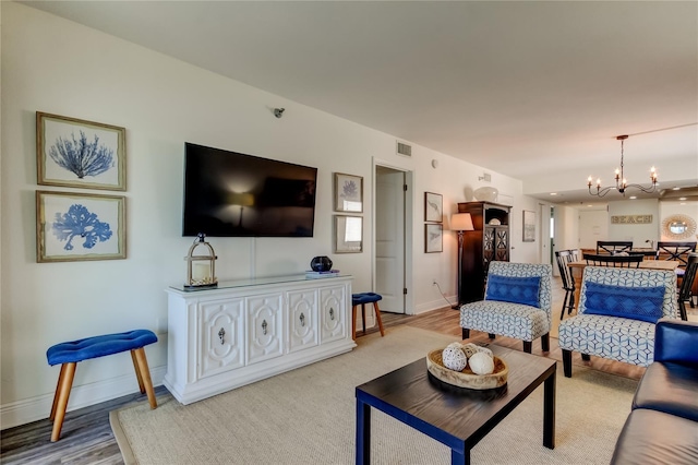 19925 Gulf Blvd Unit 502, Indian Shores, FL 33785 - living area with baseboards and a notable chandelier
