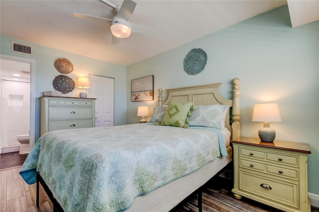 19925 Gulf Blvd Unit 502, Indian Shores, FL 33785 - bedroom featuring connected bathroom, ceiling fan, visible vents, a closet, and wood finished floors