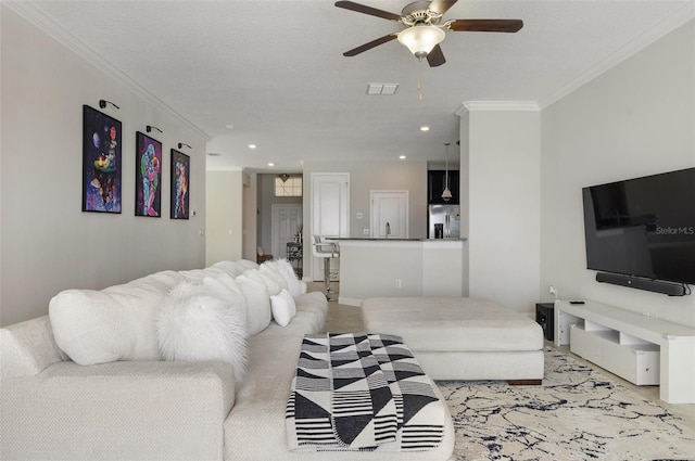 10008 Celtic Ash Dr, Ruskin, FL 33573 - living room featuring ceiling fan, ornamental molding, and recessed lighting
