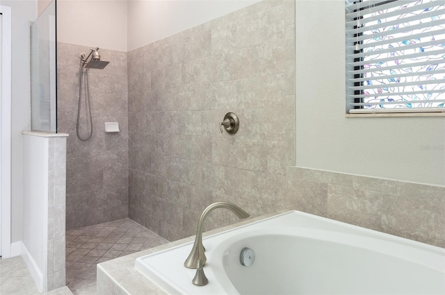 10008 Celtic Ash Dr, Ruskin, FL 33573 - bathroom with walk in shower and a garden tub