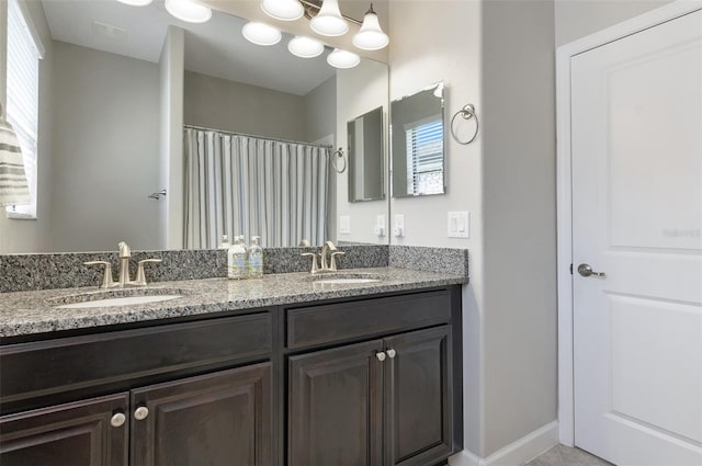 10008 Celtic Ash Dr, Ruskin, FL 33573 - full bathroom featuring double vanity and a shower with shower curtain