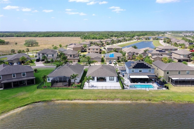 10008 Celtic Ash Dr, Ruskin, FL 33573 - aerial view of residential area featuring a pool and a large body of water