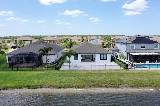 10008 Celtic Ash Dr, Ruskin, FL 33573 - back of house with a residential view, a fenced backyard, a water view, and a patio area