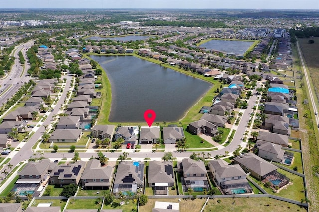 10008 Celtic Ash Dr, Ruskin, FL 33573 - aerial overview of property's location with nearby suburban area and a nearby body of water