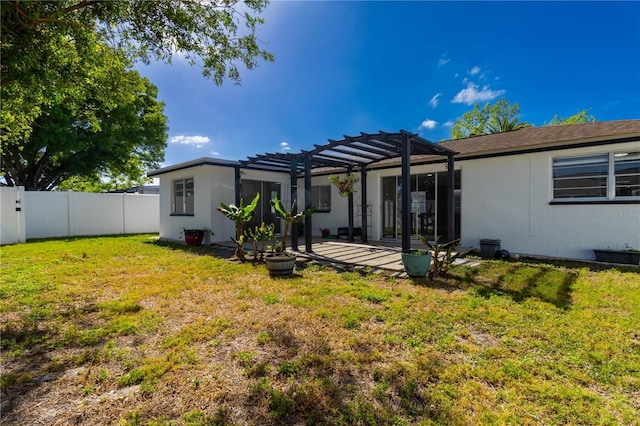 rear view of house featuring a lawn, fence private yard, a pergola, and a patio