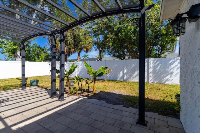 view of patio featuring a pergola and a fenced backyard