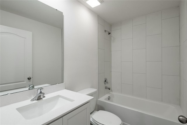 bathroom featuring shower / washtub combination, toilet, and vanity