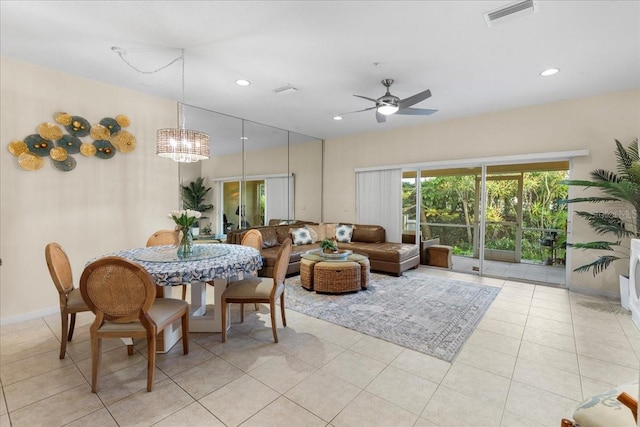 11260 Kapok Grand Cir, Madeira Beach, FL 33708 - dining space with visible vents, baseboards, light tile patterned floors, recessed lighting, and ceiling fan with notable chandelier