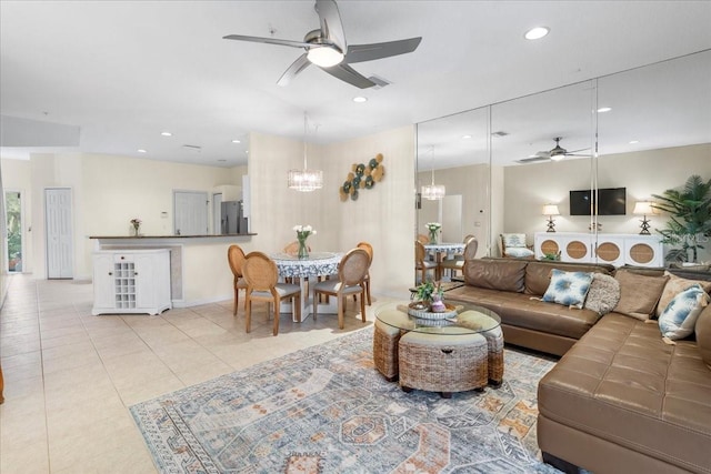 11260 Kapok Grand Cir, Madeira Beach, FL 33708 - living room with ceiling fan with notable chandelier, light tile patterned flooring, visible vents, and recessed lighting