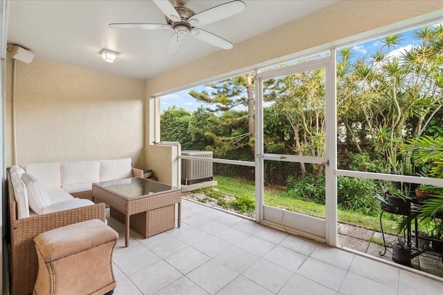 11260 Kapok Grand Cir, Madeira Beach, FL 33708 - sunroom / solarium featuring an outdoor living space and ceiling fan