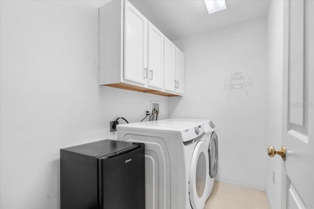 11260 Kapok Grand Cir, Madeira Beach, FL 33708 - laundry area with washing machine and dryer, baseboards, and cabinet space