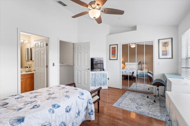11260 Kapok Grand Cir, Madeira Beach, FL 33708 - bedroom with lofted ceiling, a closet, dark wood-style floors, visible vents, and ceiling fan