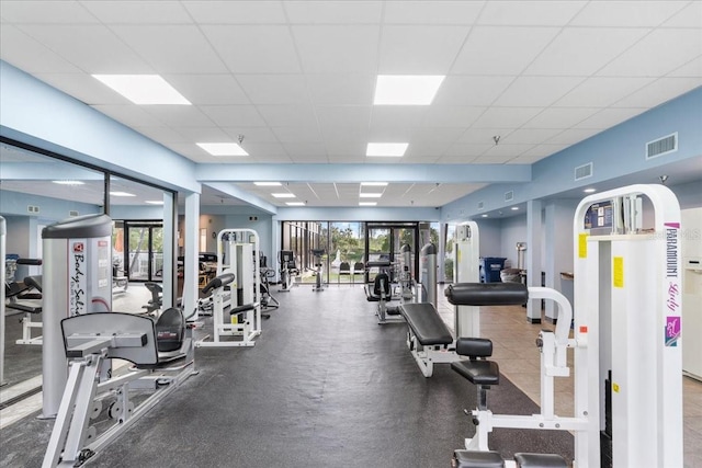 11260 Kapok Grand Cir, Madeira Beach, FL 33708 - gym with a paneled ceiling and visible vents
