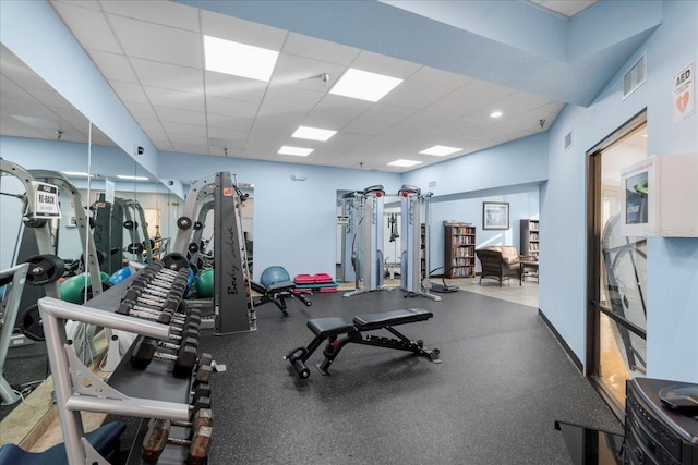 11260 Kapok Grand Cir, Madeira Beach, FL 33708 - exercise room with a paneled ceiling, baseboards, and visible vents