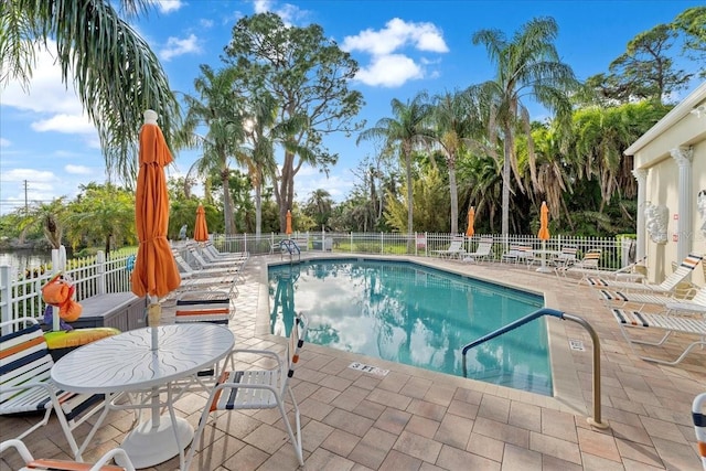 11260 Kapok Grand Cir, Madeira Beach, FL 33708 - community pool with a patio and fence