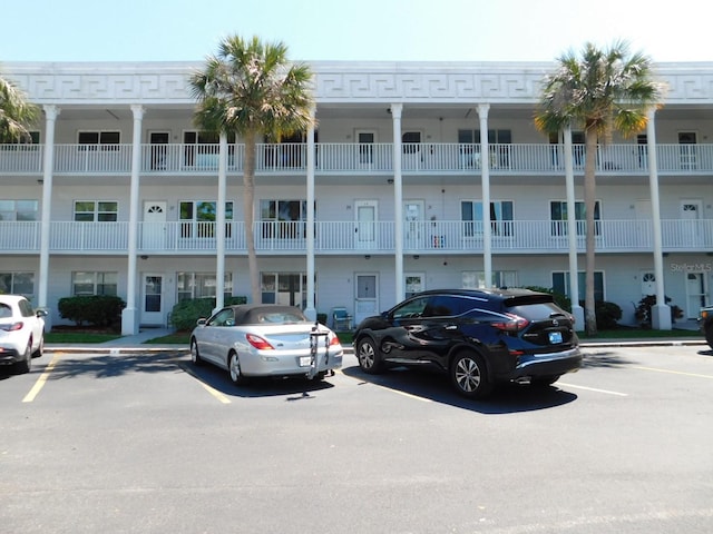 view of property with uncovered parking