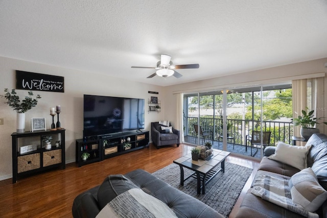 14649 Seminole Trl Unit 5, Seminole, FL 33776 - living room with a ceiling fan, wood finished floors, and a textured ceiling