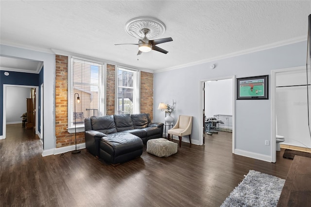 215 Central Ave Unit 4F, Saint Petersburg, FL 33701 - living room featuring baseboards, a textured ceiling, a ceiling fan, crown molding, and wood finished floors