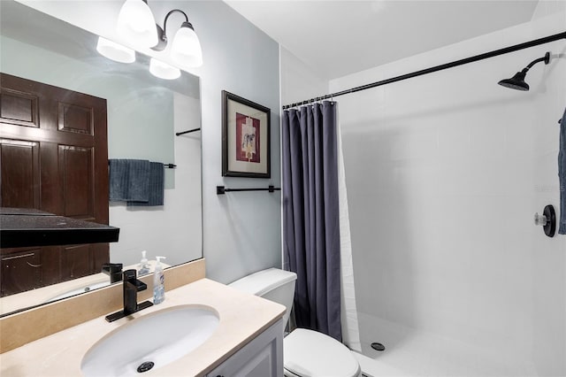215 Central Ave Unit 4F, Saint Petersburg, FL 33701 - full bathroom featuring toilet, vanity, and a tile shower