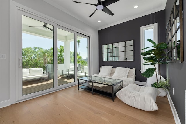 interior space featuring baseboards, ceiling fan, and wood finished floors