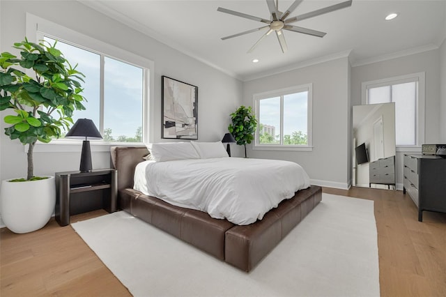 bedroom with light wood finished floors, baseboards, ceiling fan, ornamental molding, and recessed lighting