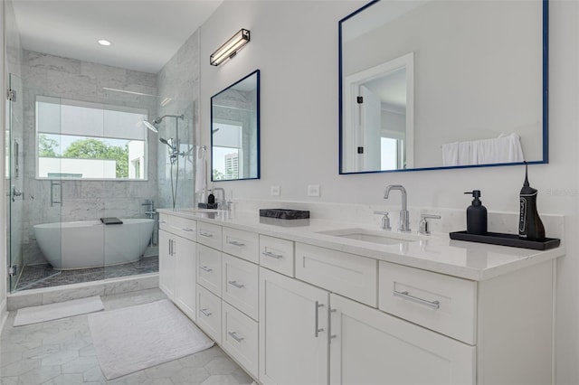 full bath with a soaking tub, double vanity, a stall shower, and a sink