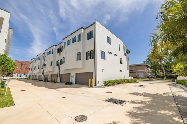 4515 W N A St Unit 8, Tampa, FL 33609 - view of building exterior with an attached garage