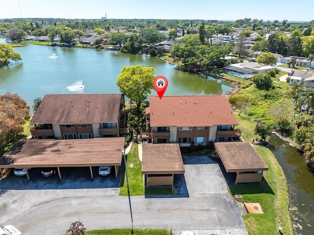 birds eye view of property with a water view