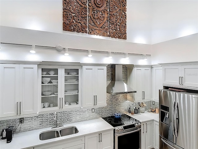 700 S Harbour Island Blvd Unit 143, Tampa, FL 33602 - kitchen featuring wall chimney range hood, light countertops, a sink, and stainless steel appliances