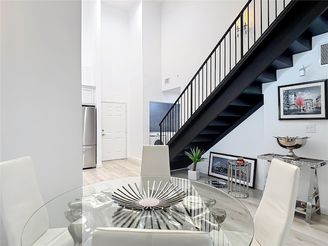 700 S Harbour Island Blvd Unit 143, Tampa, FL 33602 - stairway featuring a high ceiling, visible vents, and wood finished floors